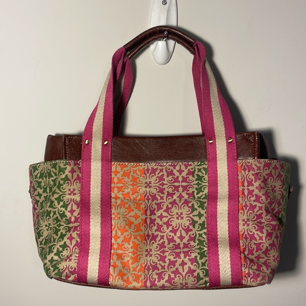 Tommy Hilfiger multicolor canvas, leather handbag. 3 outside pockets, inside zip
